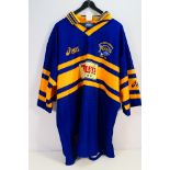 A Leeds Rhinos Asics shirt bearing multiple signatures, size XL. Appears in good condition overall.