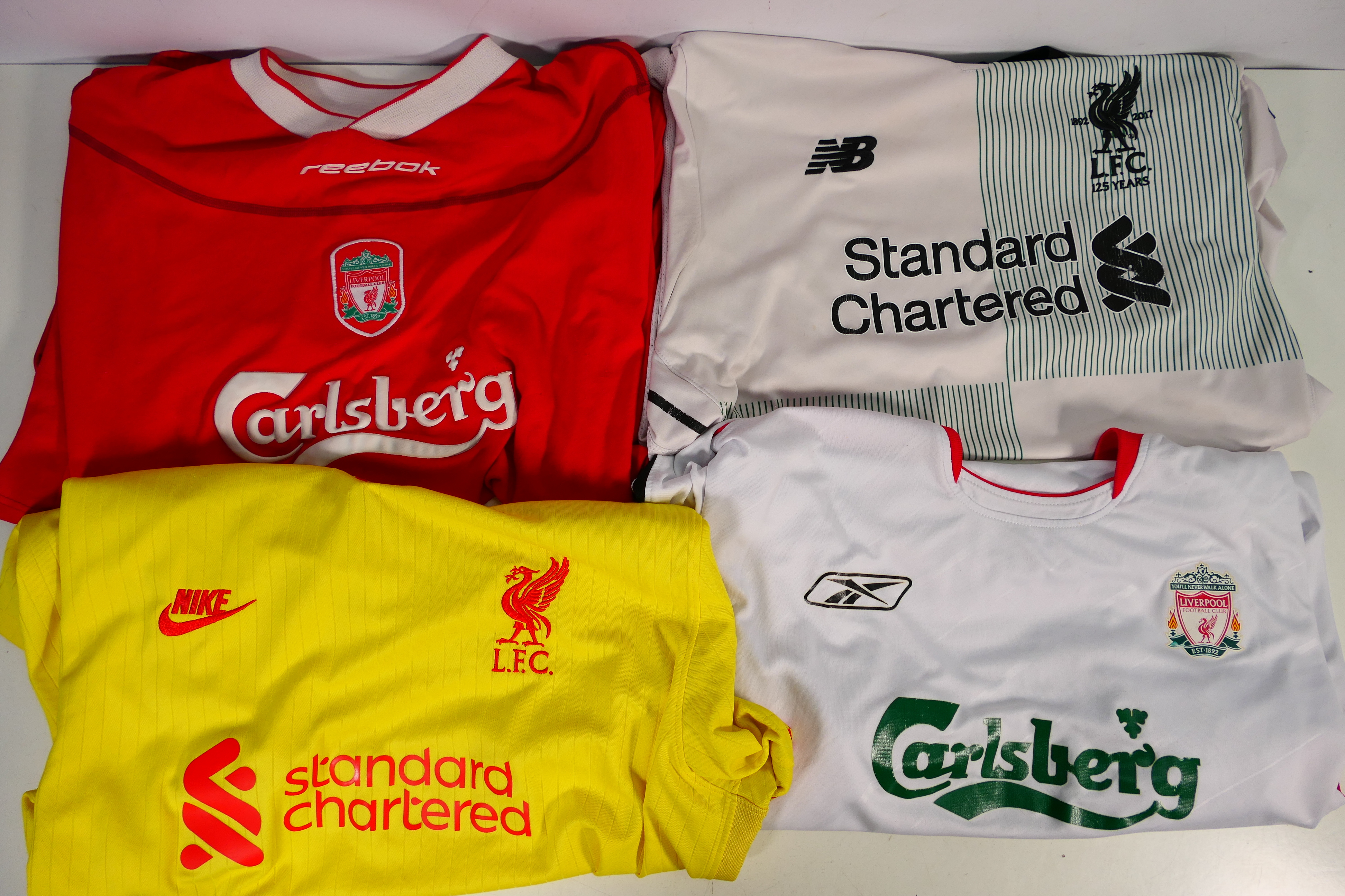 Liverpool Football Club - Four replica shirts, two Reebok with Carlsberg sponsorship,