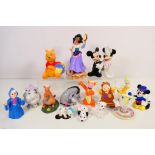 A collection of Disney themed figures / groups comprising Winnie The Pooh, Beauty And The Beast,