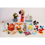 A collection of Disney themed figures / groups comprising Winnie The Pooh, Mickey Mouse,