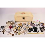 A painted wooden jewellery casket containing a quantity of costume jewellery to include bangles,