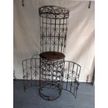 A vintage 20th century Spanish illuminated wrought iron bar with fitted wine rack and wine glass