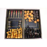 A vintage backgammon and chess set, of folding book form with two dice cups,