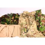 Military uniform comprising camouflage bearing insignia including Household Division and London