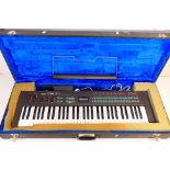 A cased Yamaha DX21 Digital Programmable Algorithm Synthesizer keyboard, untested.