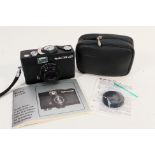 A Rollei 35 LED film camera with Rollei Triotar f/3.5 40 mm lens, case and instructions.