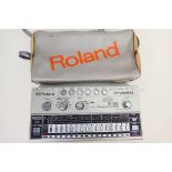 A Roland Drumatix TR-606 Computer Controlled drum machine contained in carry case.