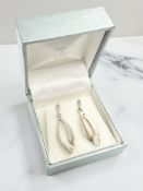 A pair of Kit Heath Scottish silver earrings set with small diamonds, length 3cm.