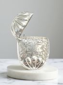 A small oval silver vesta case with engraved decoration,