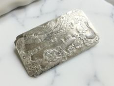 A Chinese white metal ingot, 10cm by 5.5cm.