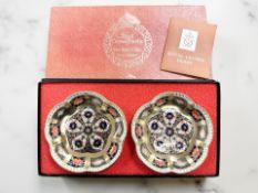 A pair of Royal Crown Derby Imari porcelain dishes, pattern 1128, diameter 11.5cm, boxed.