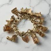 An impressive 9ct yellow gold charm bracelet CONDITION REPORT: All 12 charms are 9ct