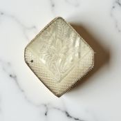 A lozenge-shaped mother of pearl brooch in gold ropework setting, stamped 9ct,