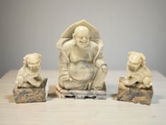 A Chinese carved soapstone figure of Buddha,