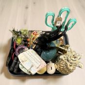 A studio glass spherical paperweight enclosing two blue fish,