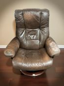 A Norwegian Ekornes Stressless brown leather swivel armchair, width 80 cm.