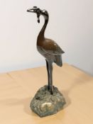 A Japanese bronze figure of a crane,
