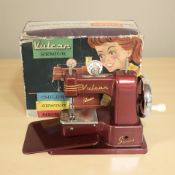 A Vulcan Senior child's sewing machine, with original box.