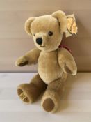 A Merrythought Limited teddy bear, with tags, height 37 cm.