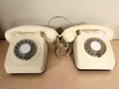 Two vintage cream plastic rotary telephones