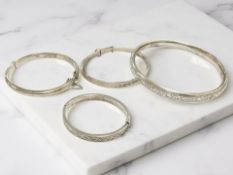 Four various silver bangles, largest 7cm inner diameter CONDITION REPORT: 27.