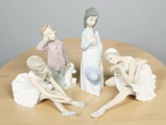 A Lladro figure of a seated ballerina, similar Nao figure, and two further Nao figures of children,
