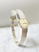 A 9ct white gold Lady's Tissot wrist watch, case 17 mm. CONDITION REPORT: 16.