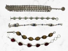 A Continental coin bracelet together with four further bracelets including synthetic ruby &