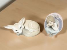 A Lladro figure of a fox and cub, length 18 cm, and a further figure of a girl.