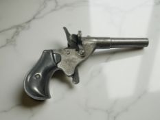 A 19th century blank-firing single-shot starting pistol,