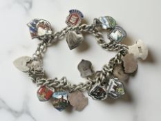 A silver bracelet with enamelled crests CONDITION REPORT: 36.