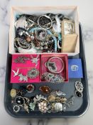 A collection of costume jewellery including several silver brooches, marcasite items, watches,
