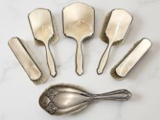 A silver and guilloché enamel five-piece dressing table set, comprising a hand mirror, length 26.