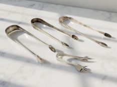 Four pairs of Georgian and later sugar tongs. CONDITION REPORT: 104g gross.