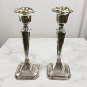 A pair of George V loaded silver candlesticks, Robert Pringle & Sons, Chester 1920, height 18cm.