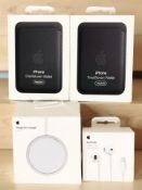 Four items of un-used Apple accessories including two FineWoven wallets,