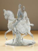 A large Lladro figure group of a bride and groom on horseback, height 43 cm.