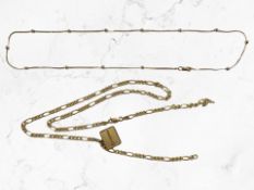 A necklace with figure-8 links spaced by spheres, stamped 14k,