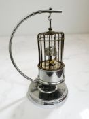 A 20th century Kaiser chrome novelty alarm clock in the form of a bird cage,