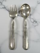 A pair of silver salad servers, Georg Jensen Ltd, London import mark 1932, length 22.5cm.