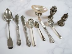 A mixed group of silver comprising a shell dish, two sifters, a Georgian table spoons,