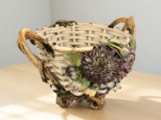 A Majolica twin-handled basket, width 29 cm.
