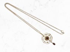 An Edwardian seed pearl and garnet pendant, stamped 15c,