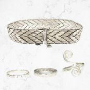 A silver herringbone-link bracelet, a silver and CZ eternity ring,