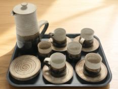 Thirteen pieces of stoneware tea wares.