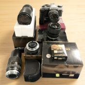 An Olympus OM-20 35mm film camera with F. Zuiko Auto-S 1:1.