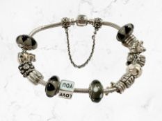 A Pandora silver charm bracelet, boxed CONDITION REPORT: 60.