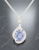 An 18ct white gold tanzanite and diamond pendant on chain,