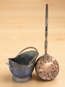 A Victorian copper coal helmet and a bed warming pan.