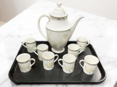A Royal Doulton White Nile coffee pot and eight coffee cans
